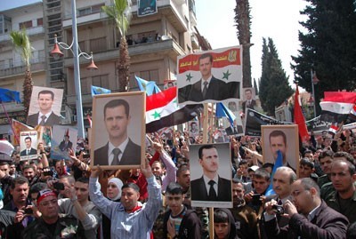People of Wadi al-Nadara in Homs march in support of army