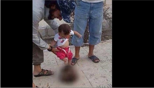 ISIS Terrorist Encourage Baby to Play with Severed Head