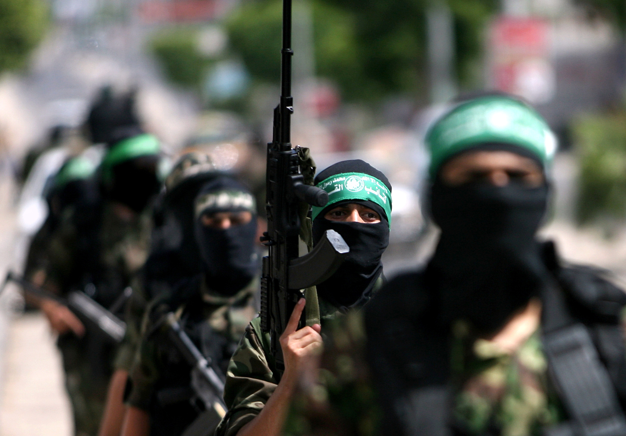 GAZA CITY, GAZA - MAY 29:  Members of the Ezzedine al-Qassam Brigades, Hamas' armed wing, parade in Rafah, southern Gaza Strip, on May 29, 2014. Palestinian President Mahmoud Abbas on Thursday officially asked Rami Hamdallah, who is currently serving as premier within the West Bank-based government, to form a new national unity government. Last month, Hamas, which rules the Gaza Strip, and Fatah, which rules the occupied West Bank, hammered out a reconciliation deal with a view to ending the rifts that have marred their relations since 2007. (Photo by Eyad Al Baba/Anadolu Agency/Getty Images)